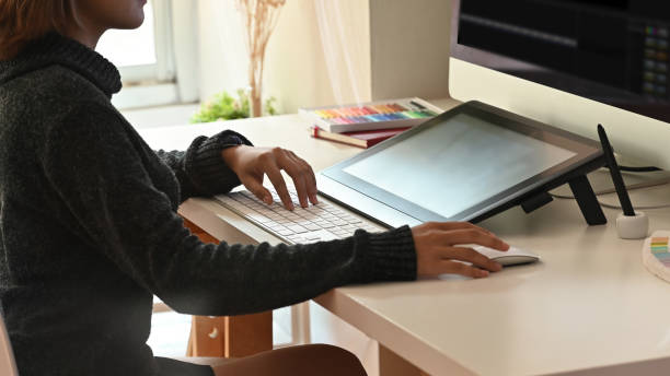 Freelancer editor video woman working on computer with cropped shot.