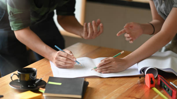 istock Cropped shot Engineer discussing meeting for architectural project working with partner and engineering tools on workplace. 1173908365