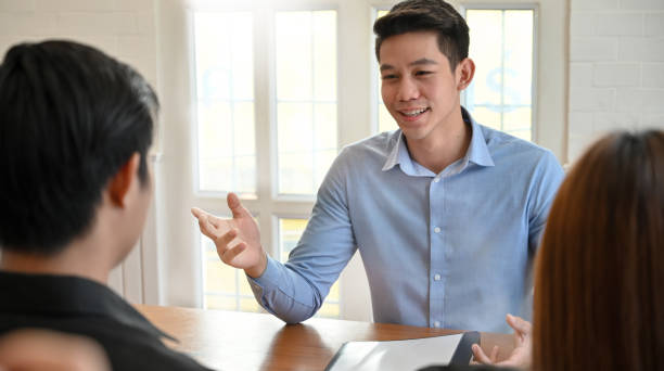 istock Young man talking with interview job in modern office. 1173909423