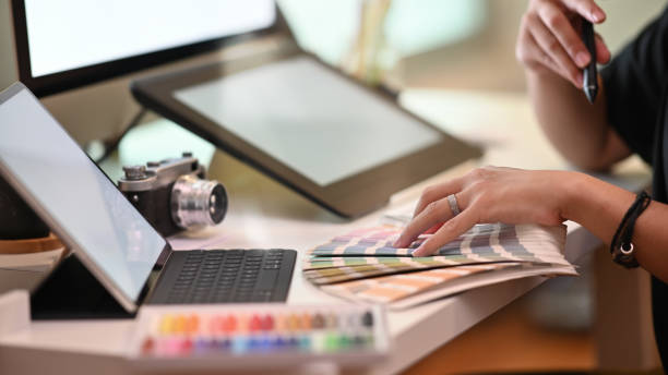istock Closeup graphic designer working with selected colour on creative workspace. 1173909467
