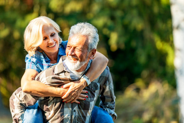 istock Senior couple piggyback riding 1173909471