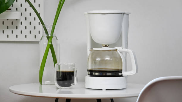 istock Coffee machine and coffee cup in office room. 1173909549
