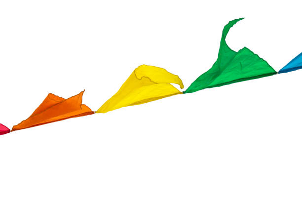 istock Multi-colored triangles flags ornament for carnival and holiday hang on a rope and flutter in the wind outdoors, isolated on a white background by clipping 1173909887