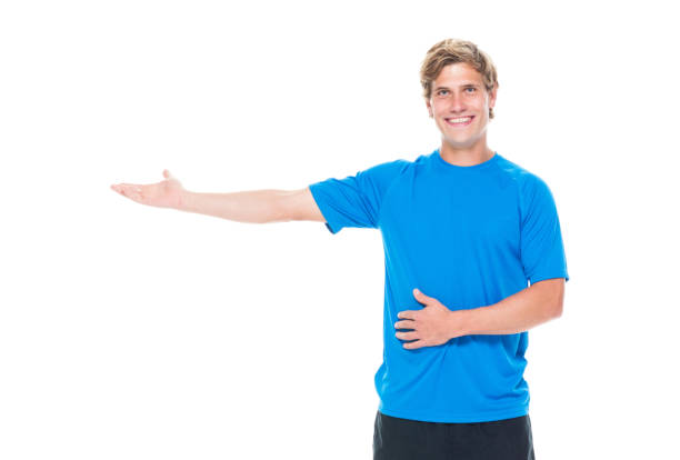 istock Handsome man in sports clothing presenting 1173912533