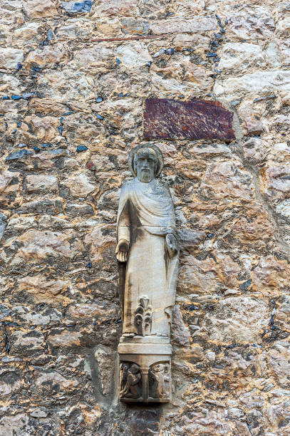 istock Stone figure on the wall of the monastery building 1173913122