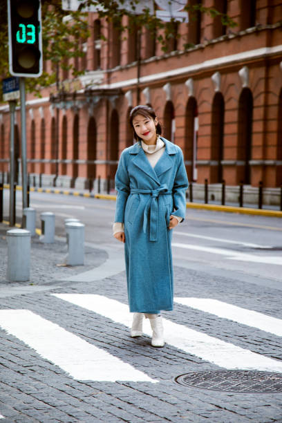 istock Blue jacket worn on a beautiful Asian girl 1173922675