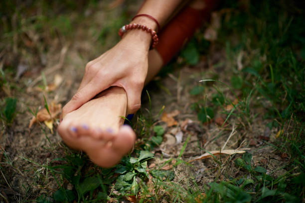 istock Woman practicing yoga in park. 1173923220