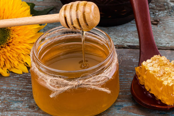 istock Honey background. Fresh honey in the pot with honeycombs 1173923243