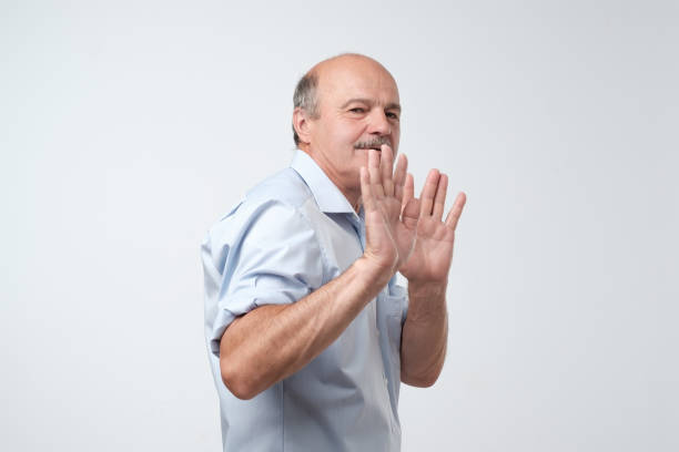 istock man showing refusal gesture. It is not for me, leave me in piece 1173925276