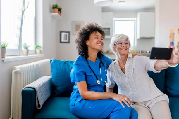 istock Female Nurse and Elderly Patient Taking a Selfie 1173927901