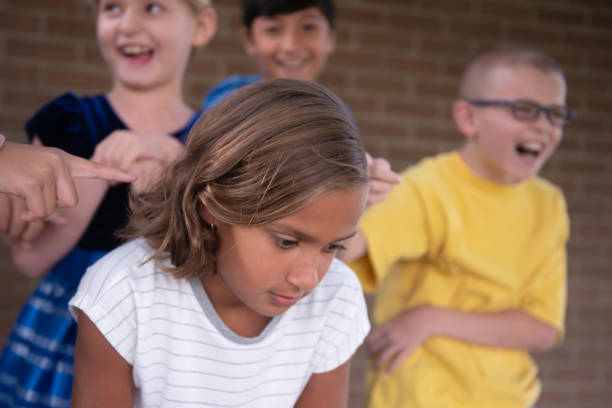 istock Social exclusion and bullying in elementary school schoolyard 1173930450