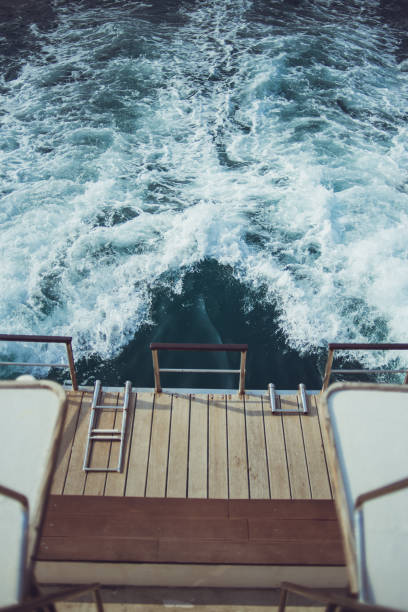 istock White waves behind a sailing ship on the sea 1173931177