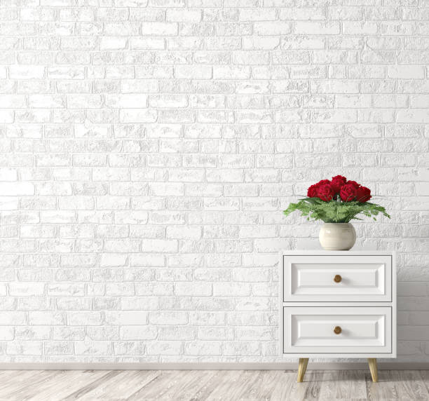 Interior with white wooden cabinet and bouquet of red roses, home decor 3d rendering Interior background of living room with white wooden cabinet and vase with bouquet of red roses over brick wall. Home decor. 3d rendering rose bouquet red table stock pictures, royalty-free photos & images