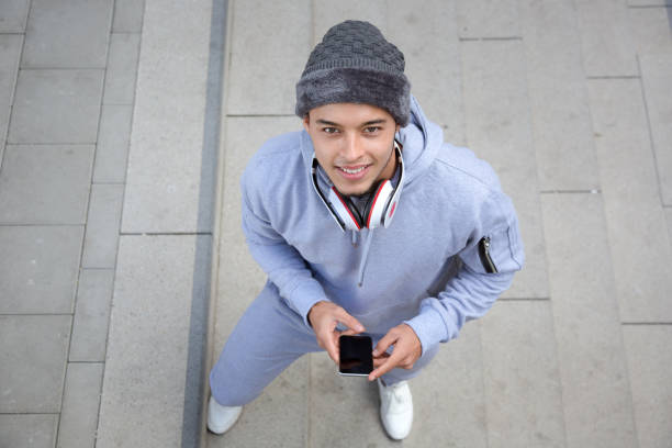 istock Smiling young latin man runner winter sports training from above 1173933408