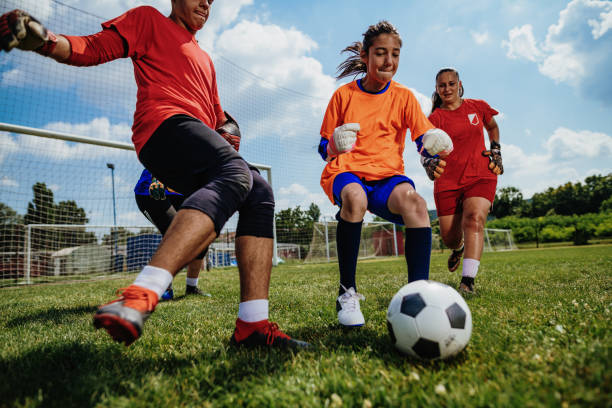 istock Teens in action - playing soccer and practicing penalty kicks for goalkeepers 1173933988
