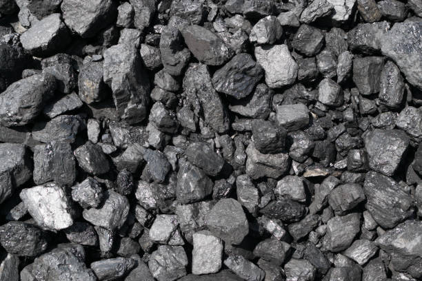 istock Pile of natural black hard coal or diamond coal background 1173936751