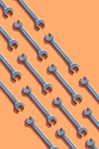 Wrenches on orange background