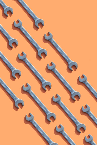 Wrenches Wrenches on orange background isolated color stock pictures, royalty-free photos & images