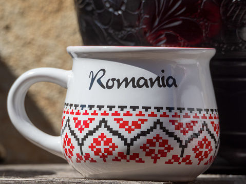 Souvenir ceramic cup with the word Romania written on it at the Rasnov citadel, Romania
