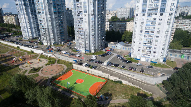 istock Soccer field among tall houses. 1173938968