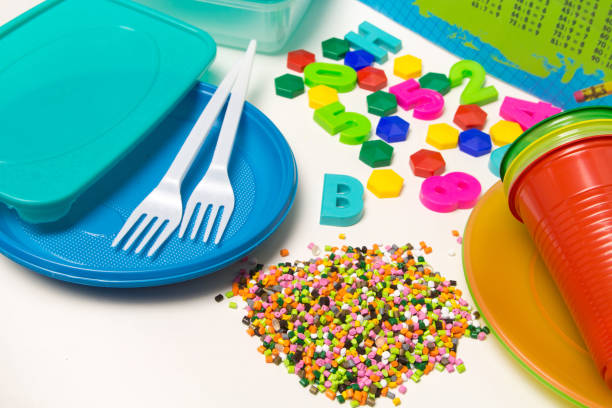 istock Plastic granules disposable tableware and children's toys made of polyethylene, polypropylene, pet polymer material on a white background. BPA FREE 1173940284