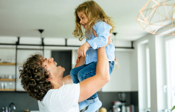 istock Feeling happy in dad's arms 1173941597