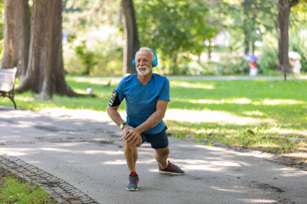 istock Senior Man is Exercising in the Public Park 1173948368