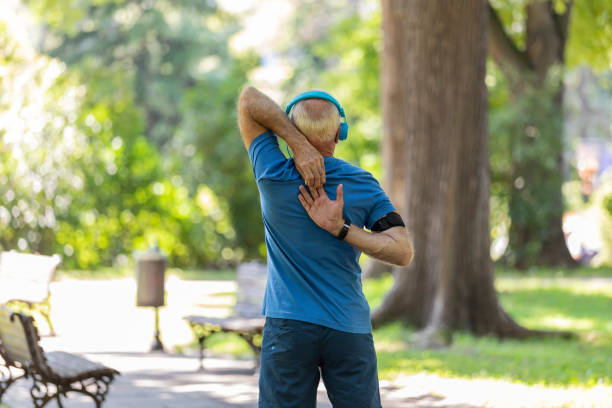 istock Senior Man is Exercising in the Public Park 1173948400
