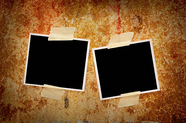 istock Blank photos on a grungy wooden background 117394873