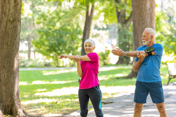 istock Senior Couple is Doing Warm-up Exercise in Public Park 1173948884