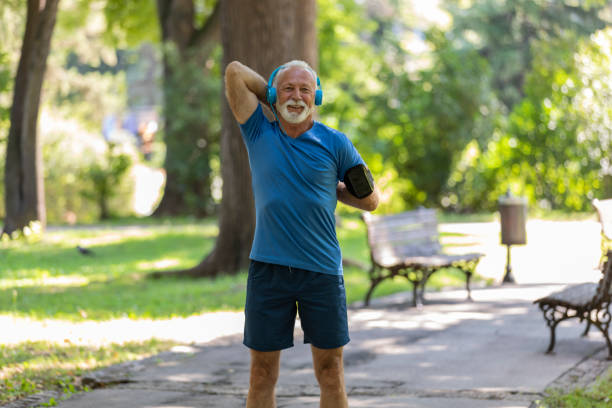 istock Senior Man is Doing Warm Up Exercise in the Nature 1173949718