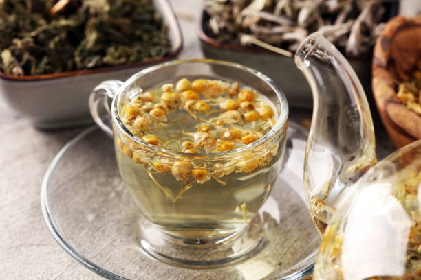 istock tea with Chamomile, sage and stinging nettle tea. Dried chamomile tea on table 1173950923