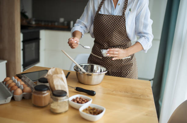 istock Concept of making a cake. Adding cake preparation ingredients 1173951153
