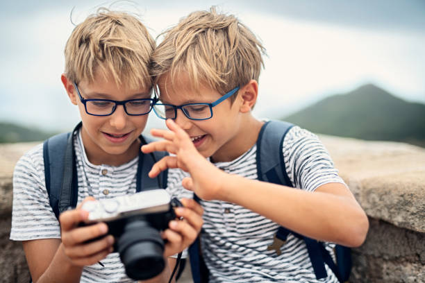 Two little photographers enjoying new camera.