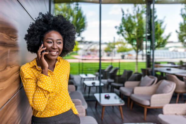 istock Smiling woman using mobile phone 1173953044