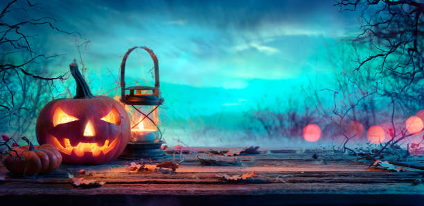 istock Halloween Pumpkin With Lantern On Table At Twilight 1173953158