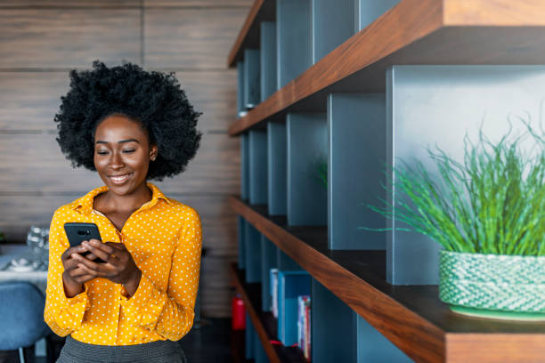 Business woman reading text message on mobile phone
