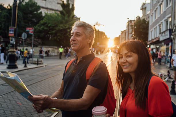 istock Senior couple with map and backpacks 1173958917