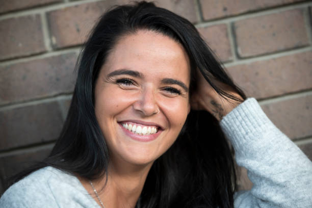 istock Happy young woman portrait 1173959559