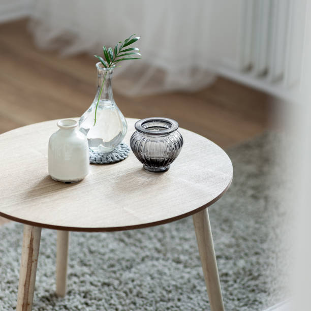 Scandinavian style coffee table Home interior with scandinavian style wooden, round coffee table coffee table stock pictures, royalty-free photos & images
