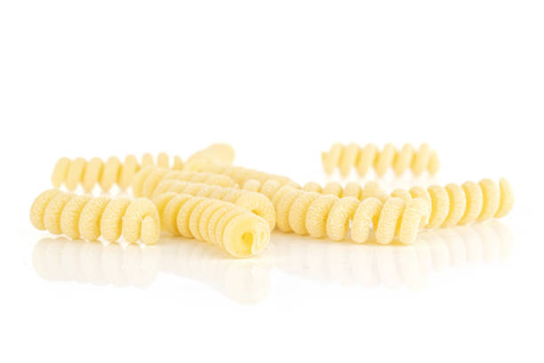 istock Raw pasta fusilli bucati isolated on white 1173959988