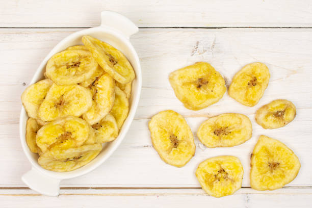 istock Yellow dry banana on grey wood 1173961814