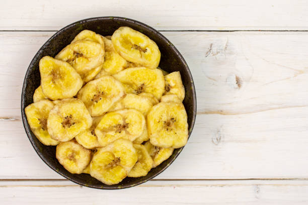 istock Yellow dry banana on grey wood 1173961899