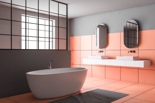 istock Orange and gray bathroom corner, tub and sink 1173963965