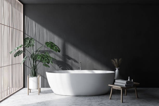 istock Gray and light wood bathroom interior with tub 1173964121