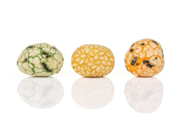 Stock photo showing a close-up, elevated view of flavoured Thai rice cakes severed as a buffet party food that can be perfectly paired with dips.