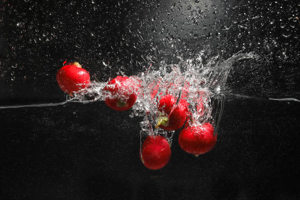 istock radishes in the water with splalshing 1173964661