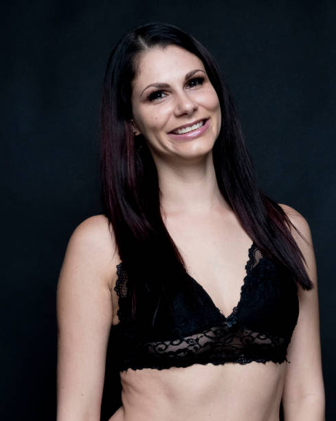istock Beautiful female in front of black background 1173968053