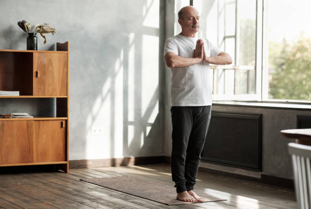 istock Hispanic man working out, yoga in basic standing asana tadasana 1173968082