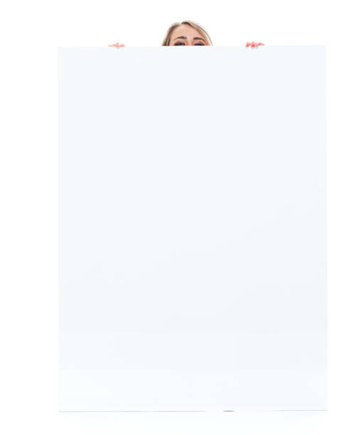 istock Beautiful female with big placard - hiding 1173974075